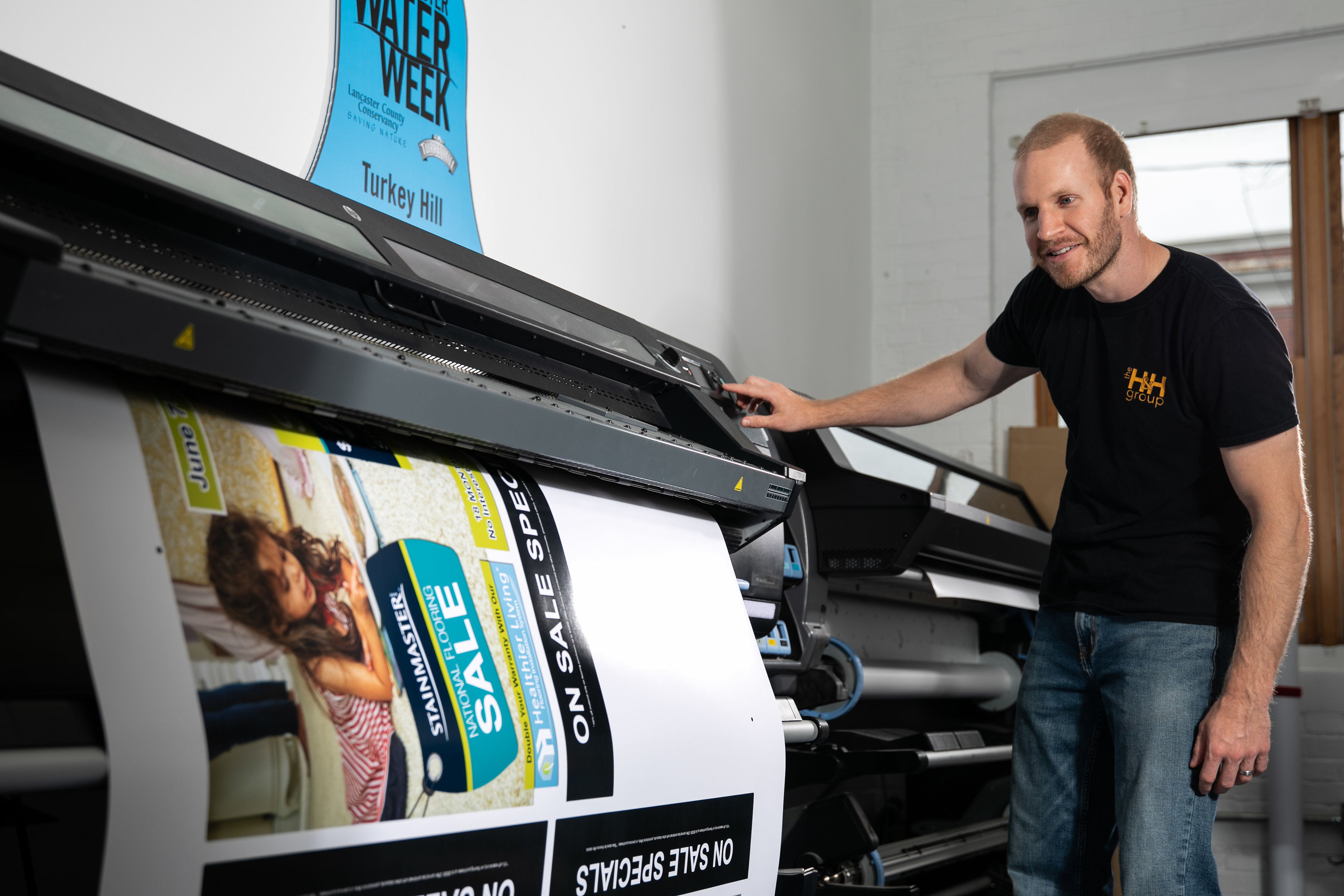 man checking on a print job