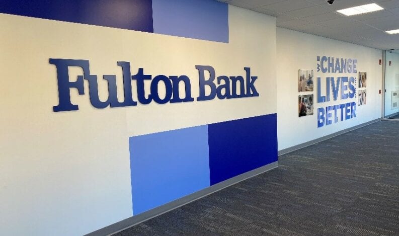 Branded photo wall by The H&H Group for Fulton Bank corporate offices