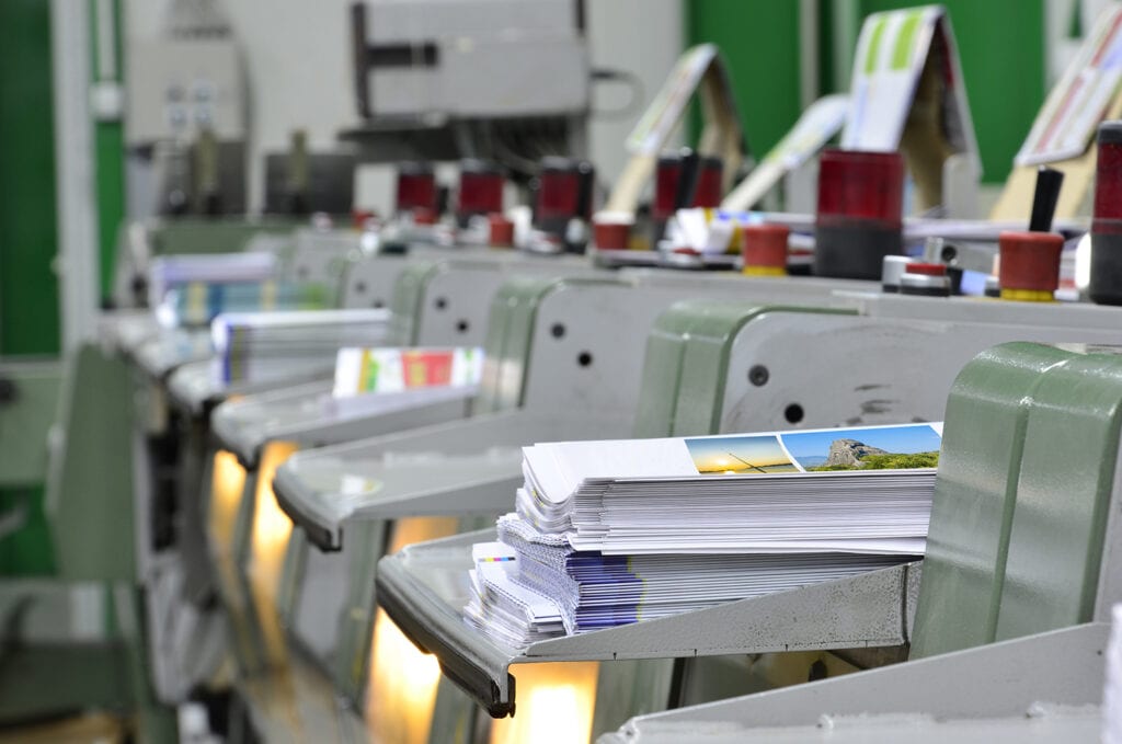 A digital printing press running short run print jobs