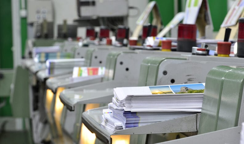 A digital printing press running short run print jobs