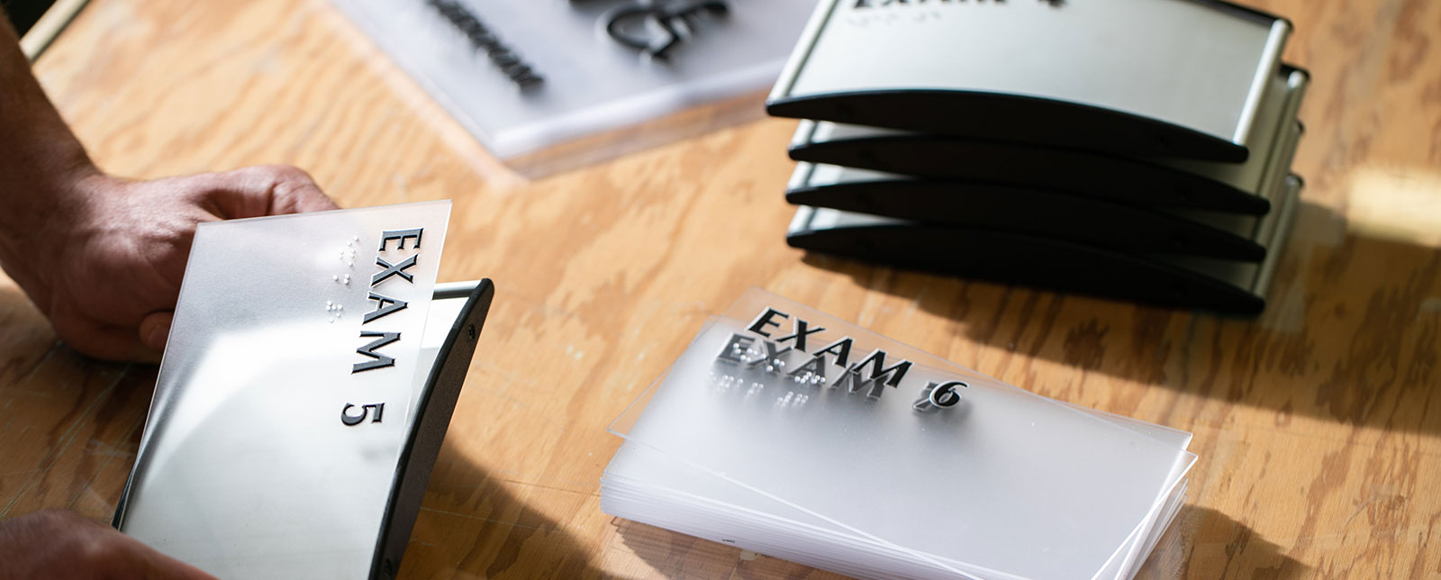 exam room signs on a table