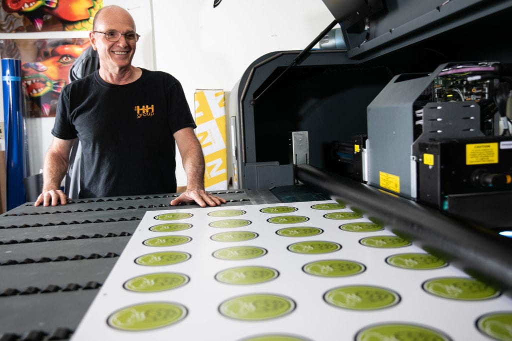 man at a printing press