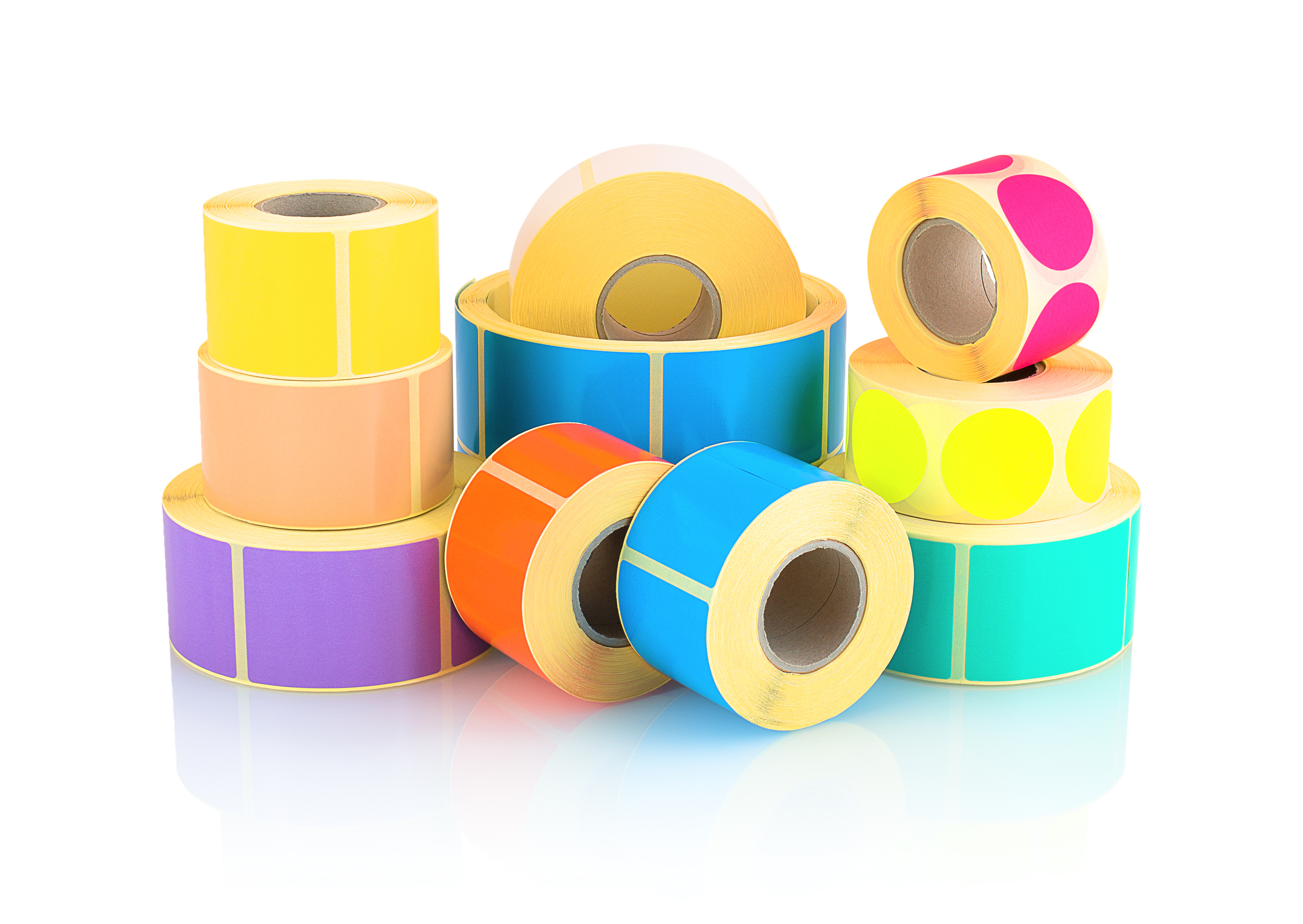 A photo of several stacks of rolls of printable adhesive labels.