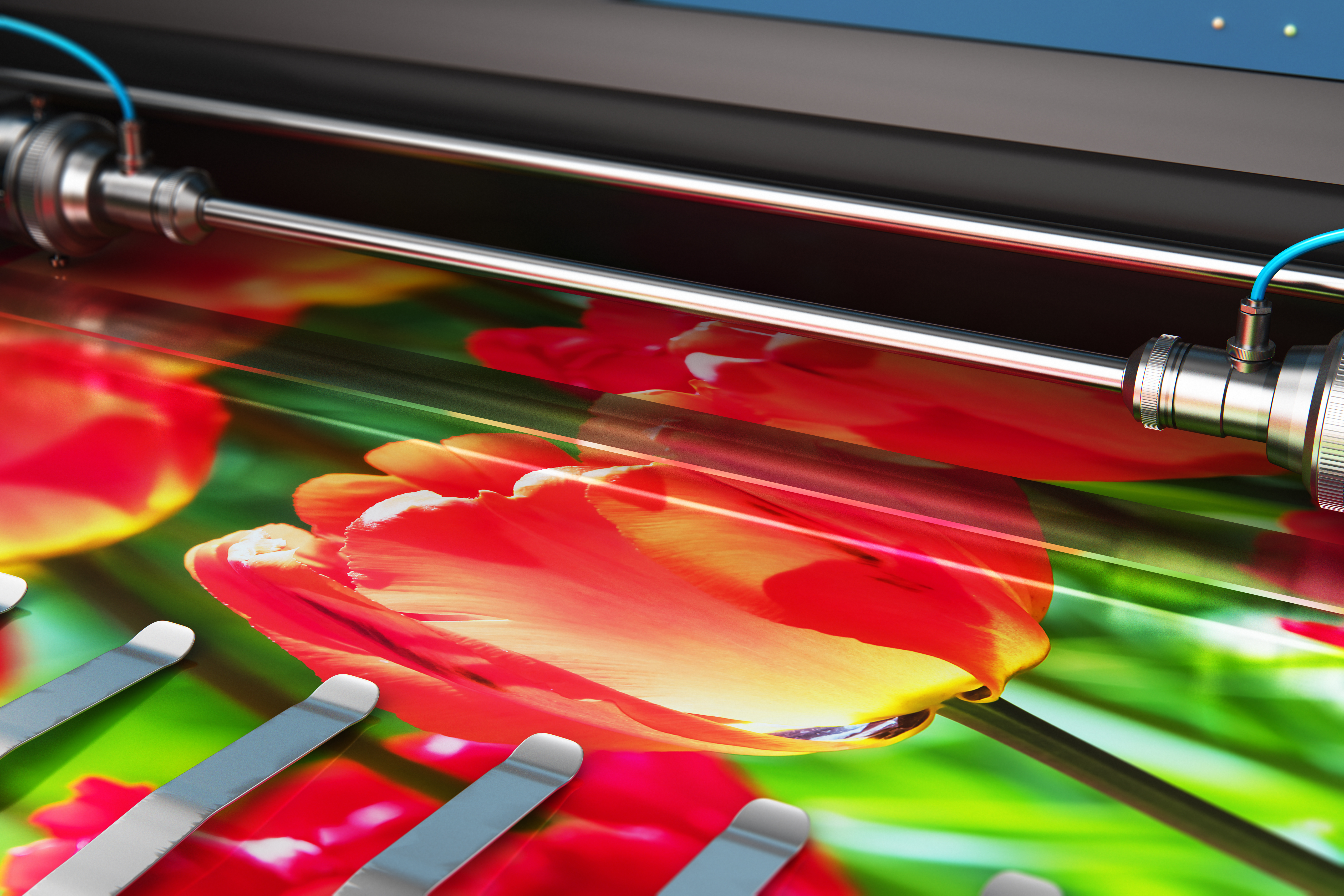 A photo of a printer producing a crisp image of red flowers.