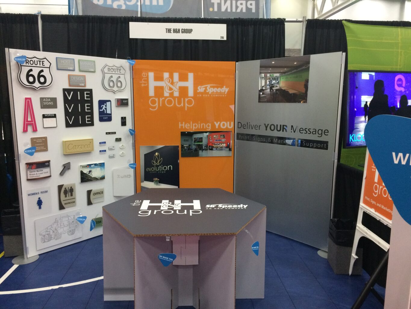 A trade show display for The H&H Group.