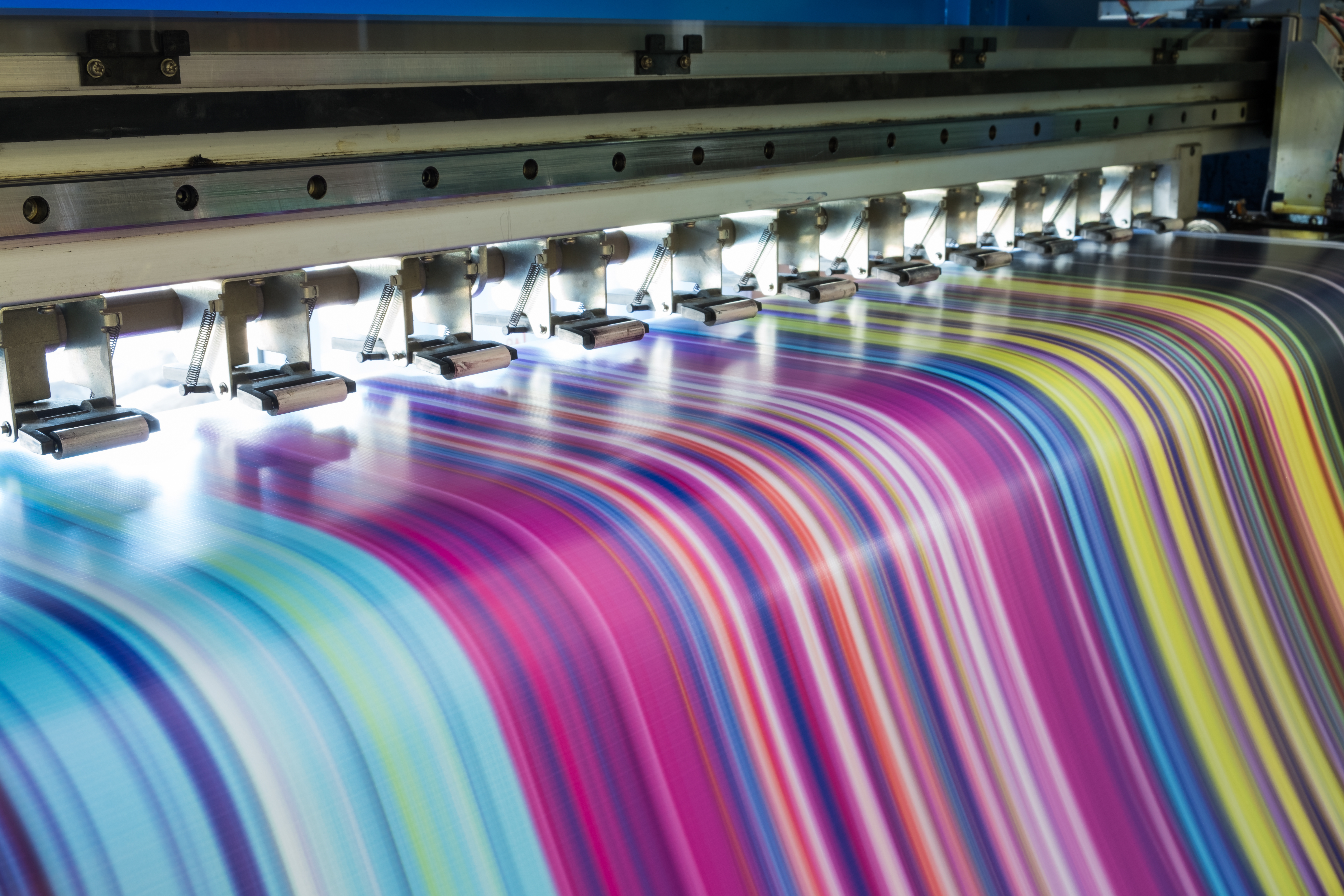 Employees review printed materials for a project